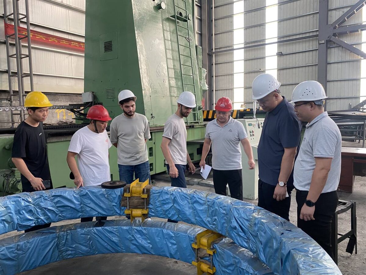 Customers reviewing a finished heavy casting with our team